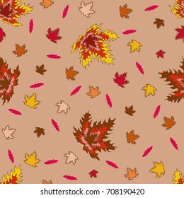 Seamless pattern of maple leaves on a brown background