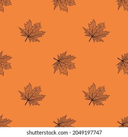 Seamless pattern with maple leaves. Vector isolated background with the contours of fallen leaves. Texture for textiles or wrapping paper. Autumn pattern.
