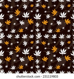 Seamless pattern of marijuana leaf on a brown background. 