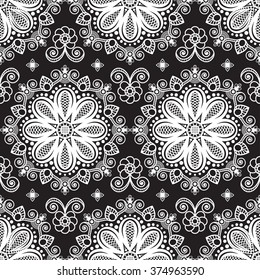 Seamless pattern mehndi background with flowers and lace buta decoration items on black background. Vector  floral wedding decorative elements isolated. 