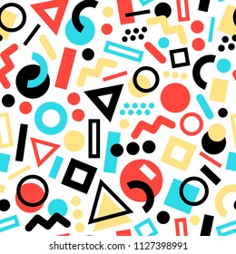 Seamless pattern of memphis style shapes. Red, yellow, blue and black colors.