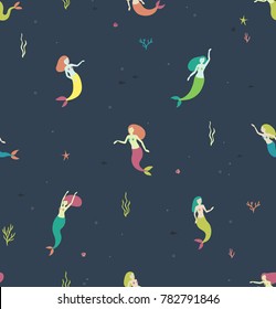 Seamless pattern with mermaids on a dark blue background