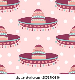 Seamless pattern with Mexican sombrero hat on a pink background. Festive design and fiesta. Decoration with ethnic ornament. Vector illustration for fabric, texture, wallpaper, posters, postcards.