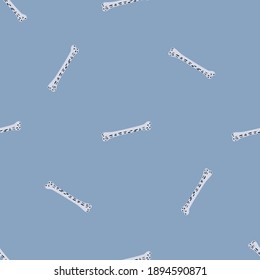 Seamless pattern in minimalistic style with white bones doodle print. Blue background. Random print. Stock illustration. Vector design for textile, fabric, giftwrap, wallpapers.