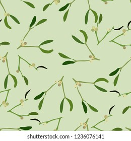 Seamless pattern of mistletoe on a green background