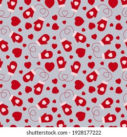 Seamless pattern of mittens and hearts on a gray background. Vector illustration. Background.