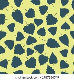 Seamless pattern with mix of dark green blue leaves on a yellow background. Vector.