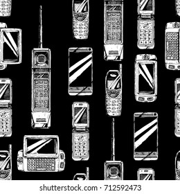 Seamless pattern with mobile phone. Vector illustration in vintage engraved style on black background.  