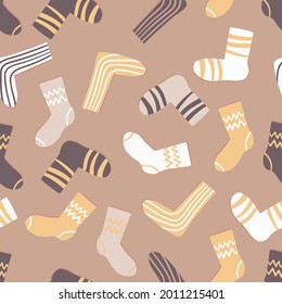 Seamless pattern with modern colorful socks. Trendy accessories in doodle style. Various cotton foot cloth. Cartoon socks for web and print, for invitation, card, fabric, textile. Vector illustration.