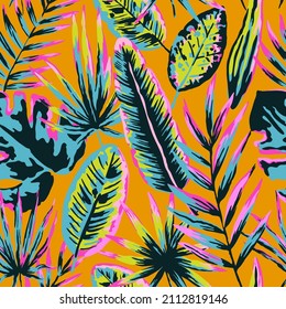 Seamless pattern with modern neon tropical leaves and plants for design and textile.