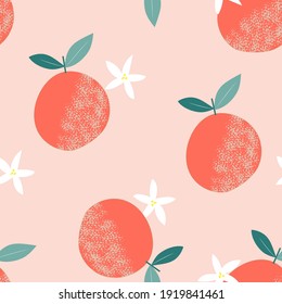 
seamless pattern in modern style. print in flat style with oranges and leaves. tropical design.