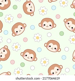 Seamless pattern of monkey faces, flowers and dots on a green background.