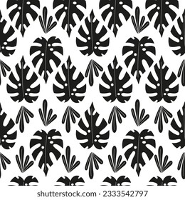 Seamless pattern with monochrome tropical palm leaves. Exotic foliage background.