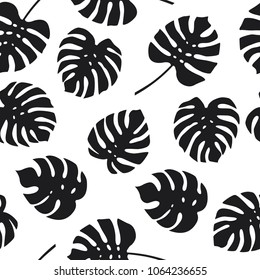 Seamless pattern of monstera leaves on white background