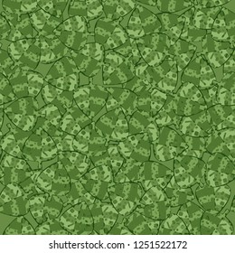 Seamless pattern. Motley green leaves in random order. Camouflage style.
