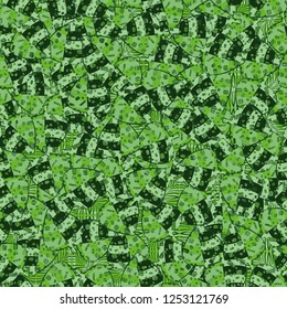 Seamless pattern. The motley-green leaves of maple lying on a background of coarse and openwork weaving. Camouflage.