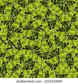 Seamless pattern. Motley-green leaves in random order are placed on a substrate of a grid. Camouflage style.