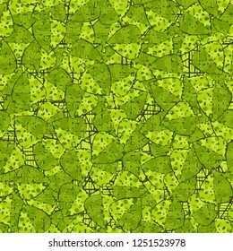 Seamless pattern. Motley-green leaves in random order are placed on a substrate of a grid. Camouflage style.