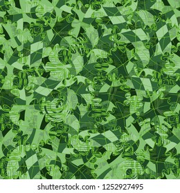 Seamless pattern. The motley-green leaves are scattered randomly against the background of three-layer patterns. Camouflage style.