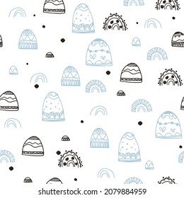 Seamless pattern with mountains and ethnic doodles. Handmade decorations. Seamless pattern for fabric, paper, wrapping, clothing, textile, wallpaper. Vector illustration