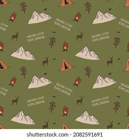 Seamless pattern with mountains, tents and a campfire. Camping concept. For printing on fabrics, notebooks and other purposes.