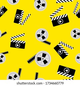 Seamless pattern of movie clapperboard and a reel of tape. Flat vector illustration.