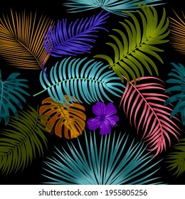 Seamless pattern with multicolor tropical leaves of palm tree. Jungle vector background.