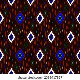 Seamless pattern with multicolored diamonds. Geometric chevron abstract illustration, wallpaper. Tribal ethnic vector texture. Aztec style. Folk embroidery. Indian, Scandinavian, African rug.