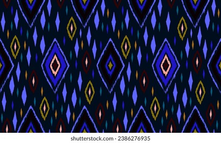 Seamless pattern with multicolored diamonds. Geometric chevron abstract illustration, wallpaper. Tribal ethnic vector texture. Aztec style. Folk embroidery. Indian, Scandinavian, African rug.