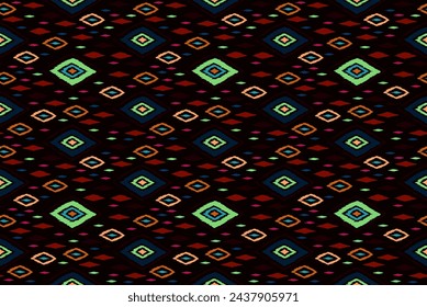 Seamless pattern with multicolored diamonds. Geometric chevron abstract illustration, wallpaper. Tribal ethnic vector texture. Aztec style. Folk embroidery. Indian, Scandinavian, African rug.