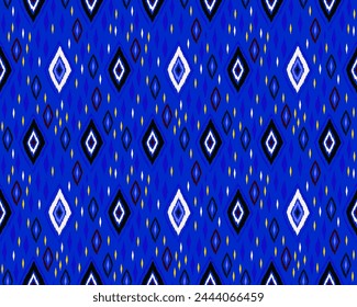 Seamless pattern with multicolored diamonds. Geometric chevron abstract illustration, wallpaper. Tribal ethnic vector texture. Aztec style. Folk embroidery. Indian, Scandinavian, African rug.