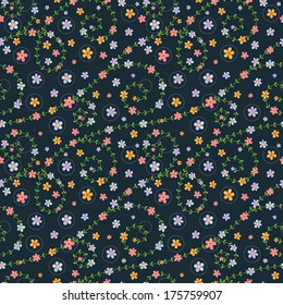 Seamless pattern with multicolored flowers on dark blue background