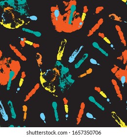 seamless pattern of multicolored handprints on a black background. it can be used for decoration of textile products, creating an abstract background. stock vector illustration. EPS 10.