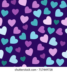 Seamless pattern multicolored hearts on a dark blue background