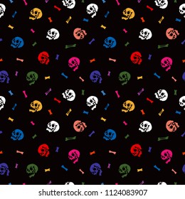 Seamless pattern. Multicolored human skulls and bones on a black background. Human anatomy. A funny print for Halloween.