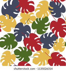 seamless pattern with multi-colored monstera palm leaves. Summer vector tropical design. An exotic texture for fabric, home, decor & more.
