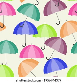 A seamless pattern with multicolored open umbrellas