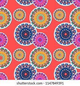 Seamless pattern with multi-colored ornamented balls on a coral background. Vector illustration