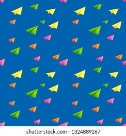 seamless pattern of multi-colored paper airplanes on blue background