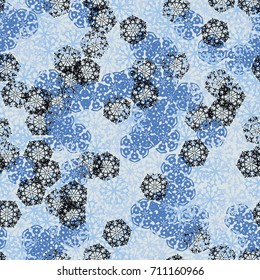 Seamless pattern. Multicolored snowflakes. Fashionable camouflage for urban and suburban clothing. Festive background for the 2018 meeting. Flat. Random order. Blue tones, black.