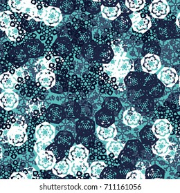 Seamless pattern. Multicolored snowflakes. Fashionable camouflage for urban and suburban clothing. Festive background for the 2018 meeting. Flat. Random order. Gray-blue, blue-green, white.