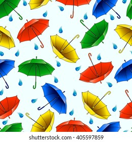 Seamless pattern from multi-colored umbrellas. Vector illustration.