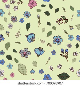 Seamless pattern with multicolored wildflowers with leaves on a light green background