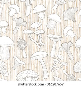 Seamless pattern with mushrooms. Graphical illustration of mushrooms on wooden background.