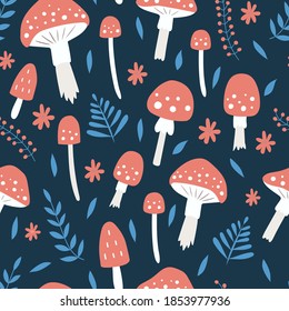 Seamless pattern with mushrooms, leaves and flowers on a dark blue background. Fly agaric seamless pattern. Vector illustration. For wallpaper, textiles, fabric, paper.