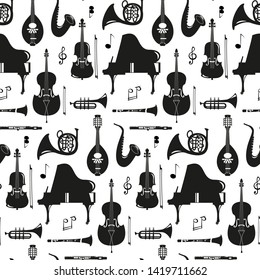 Seamless pattern with musical instruments on the white background. Vector illustration.