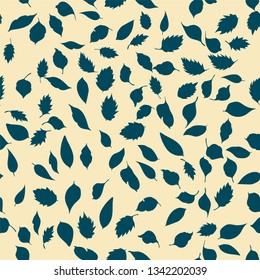 Seamless pattern. Natural motives. leaves randomly scattered on a light background