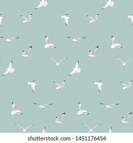 Seamless pattern of nautical birds - marine seagulls on a light cyan background. Vector illustration.