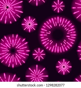 Seamless pattern with neon glowing sunbursts or fireworks on dark purple background. Vector 10 EPS illustration