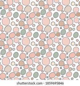 Seamless pattern with neutral colored hand drawn doodle circles on white background